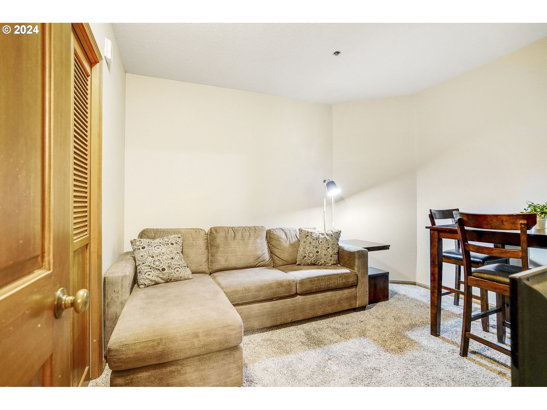 652 Wimbledon Court Eugene, OR 97401 - Photo 15 of 35 a living room with furniture and a flat screen tv