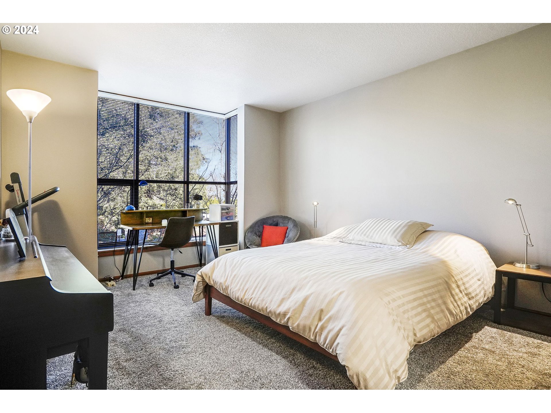 652 Wimbledon Court Eugene, OR 97401 - Photo 18 of 35 a bedroom with a bed and a table