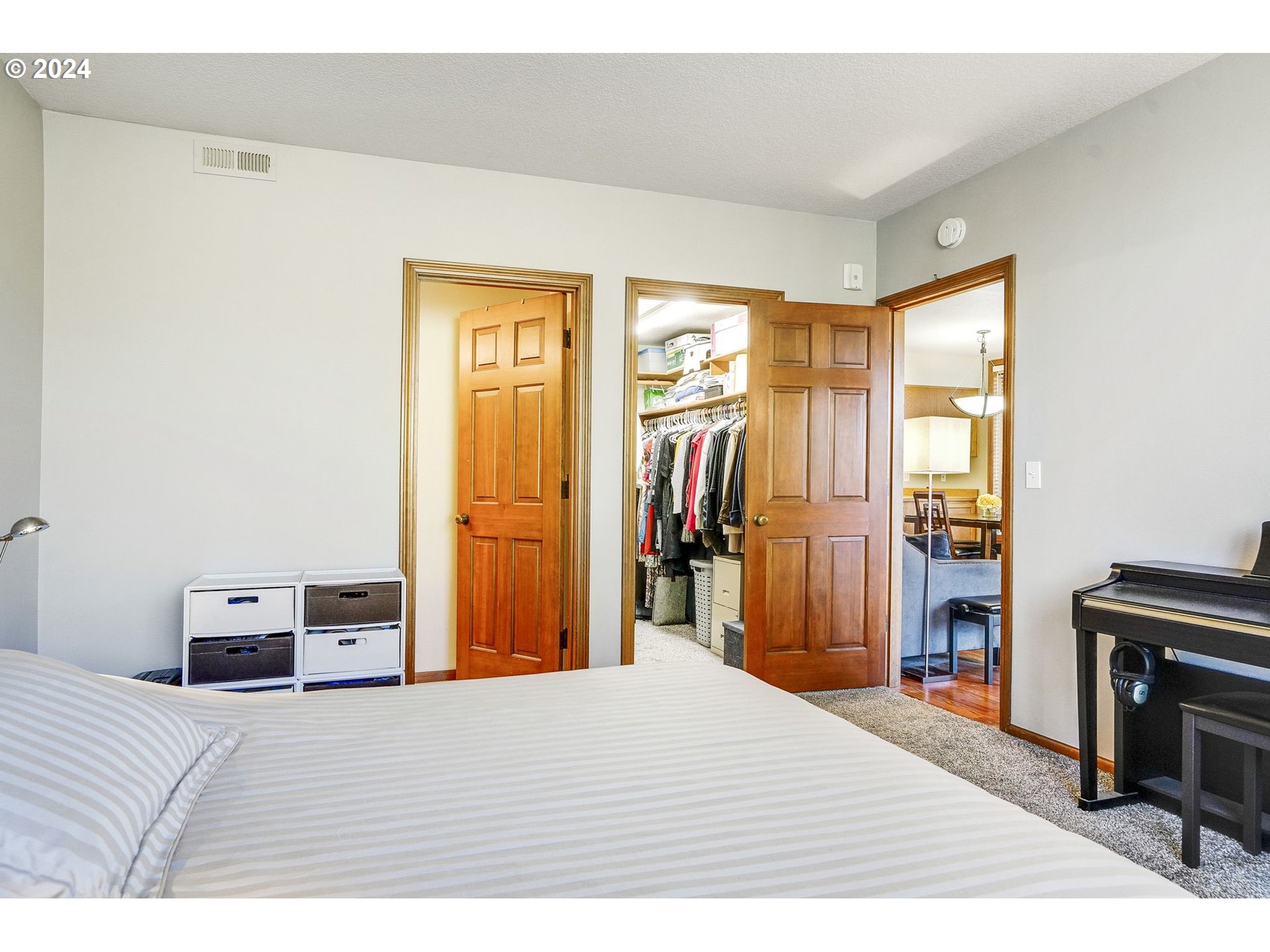 652 Wimbledon Court Eugene, OR 97401 - Photo 22 of 35 a bedroom with a bed and a dresser