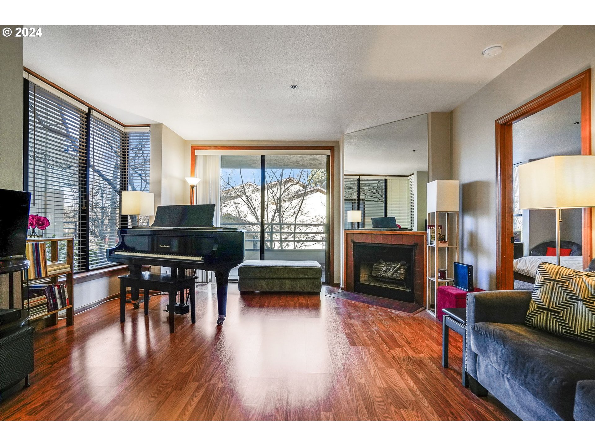 652 Wimbledon Court Eugene, OR 97401 - Photo 4 of 35 a living room with fireplace furniture and a wooden floor