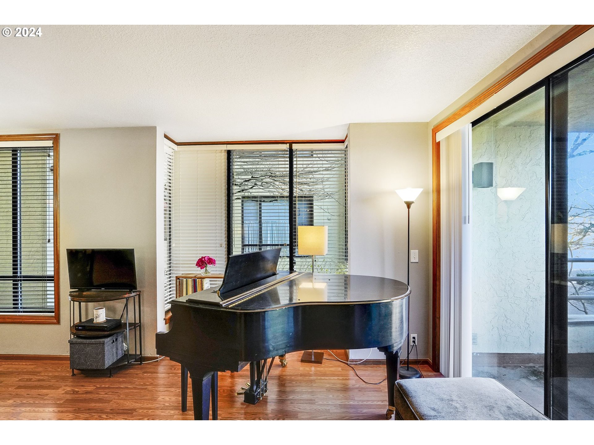 652 Wimbledon Court Eugene, OR 97401 - Photo 6 of 35 a living room with furniture a flat screen tv and a table