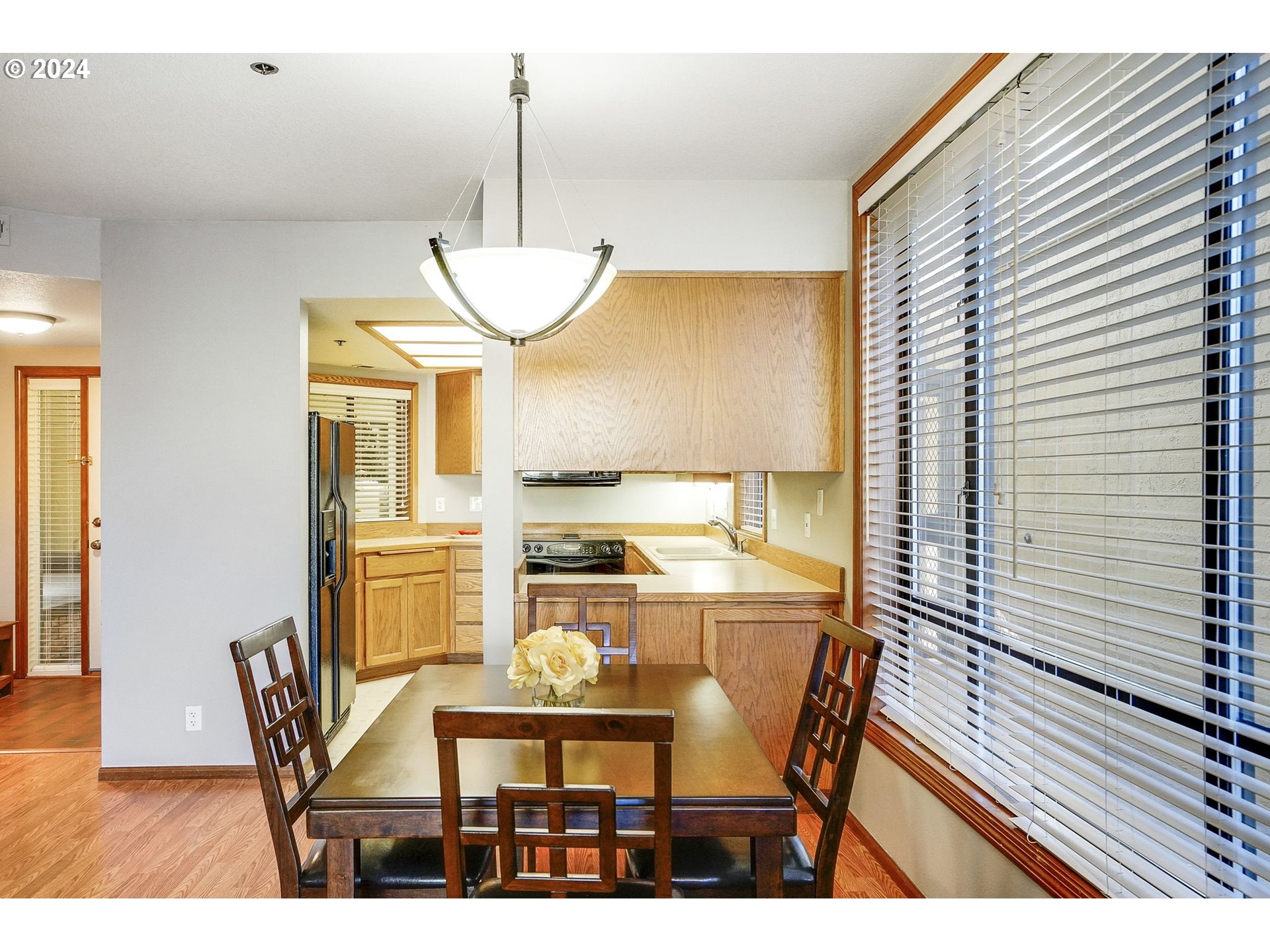 652 Wimbledon Court Eugene, OR 97401 - Photo 9 of 35 a view of a dining room with furniture window and wooden floor