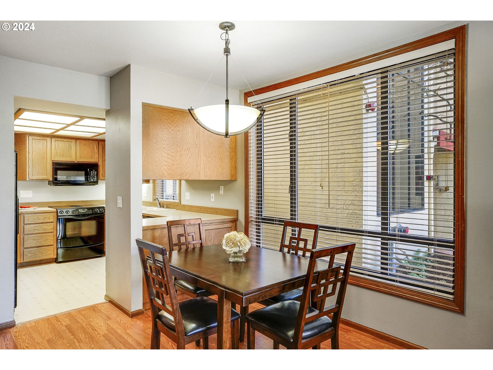 652 Wimbledon Court Eugene, OR 97401 - Photo 10 of 35 a view of a dining room with furniture and wooden floor