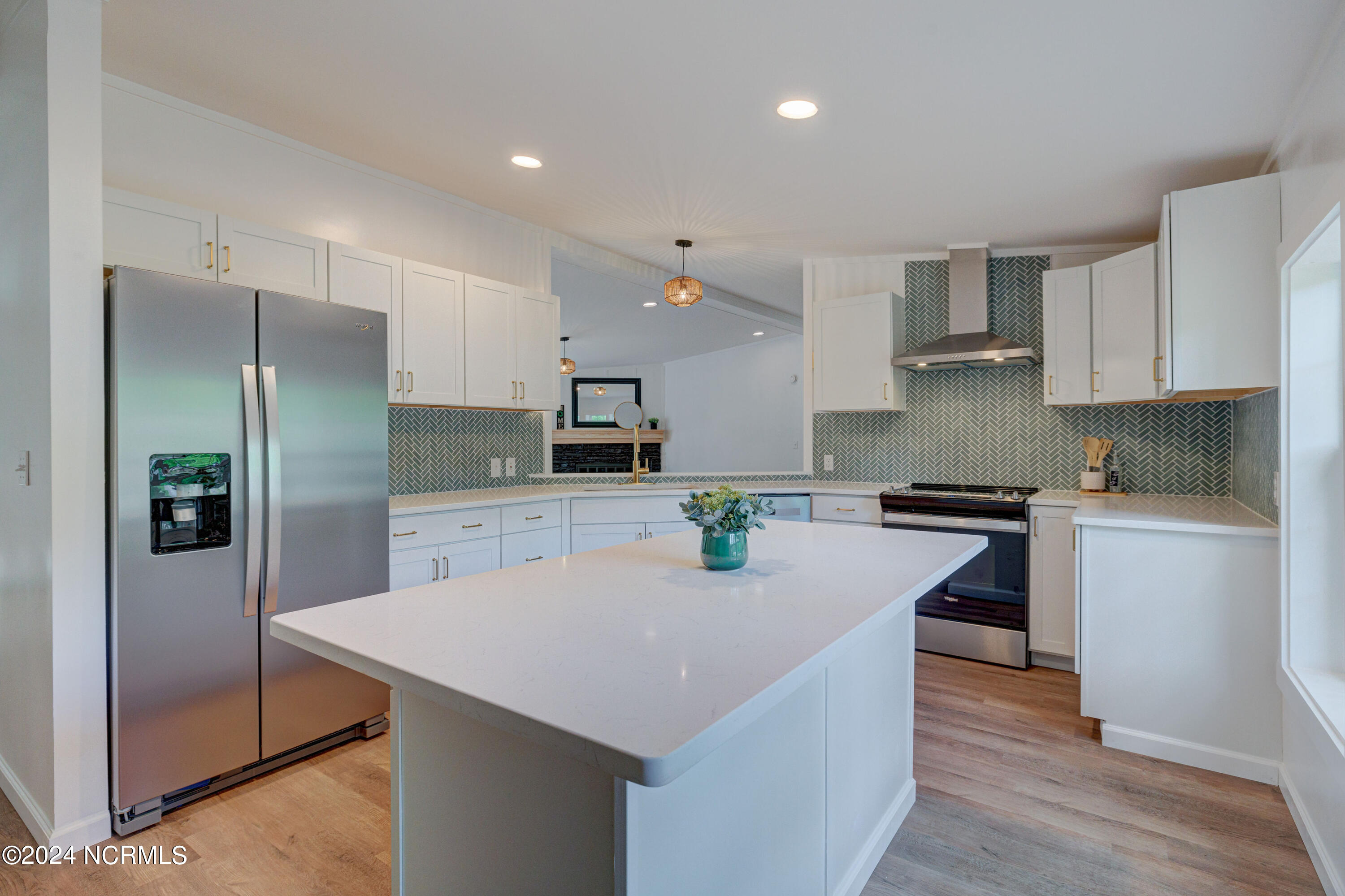 328 Groves Point Circle Hampstead, NC 28443 - Photo 5 of 39 Kitchen Island Fireplace View
