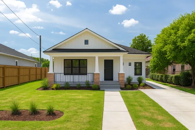 a view of a house with a yard and sitting area