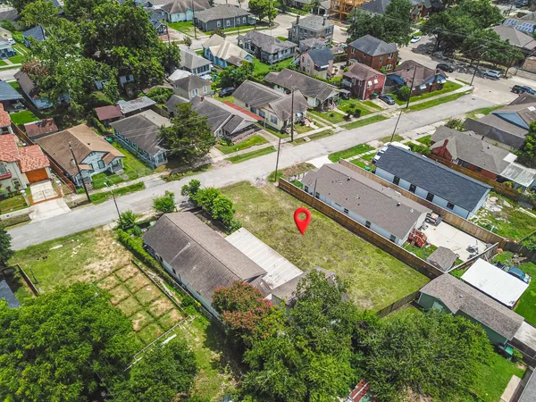 an aerial view of residential houses with outdoor space