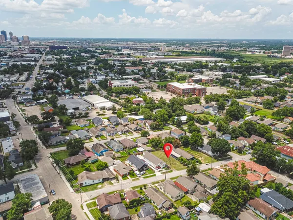 an aerial view of residential houses with outdoor space