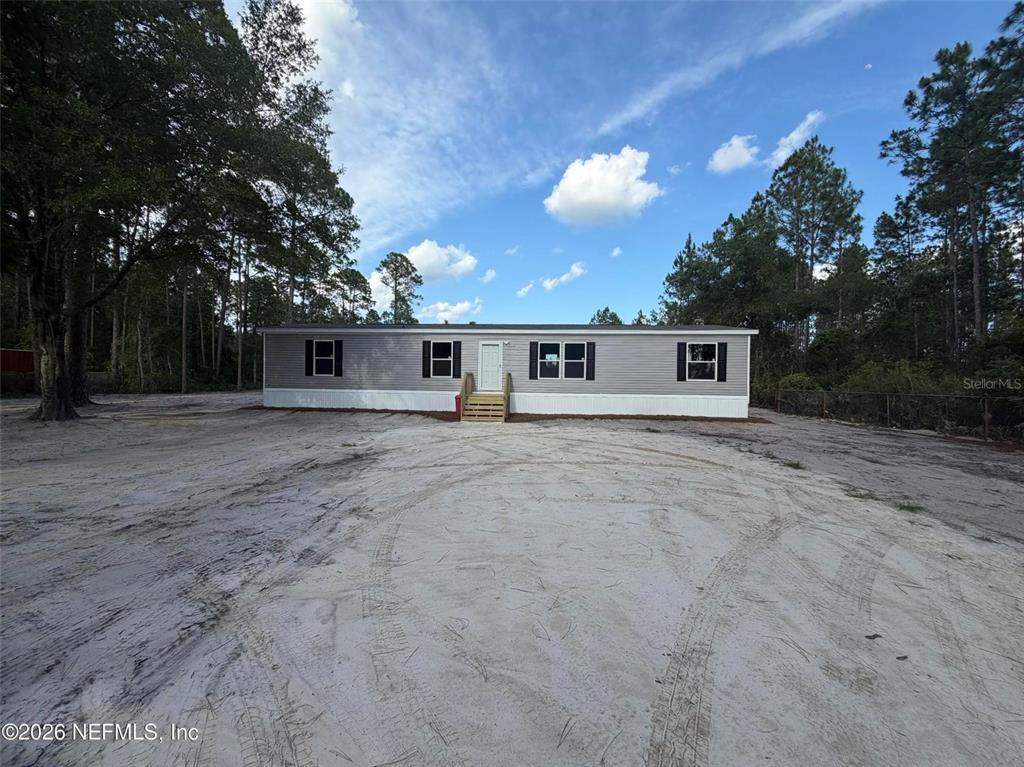 114 Nutmeg Trail Interlachen, FL 32148 - Photo 4 of 33 a outdoor space with lots of trees