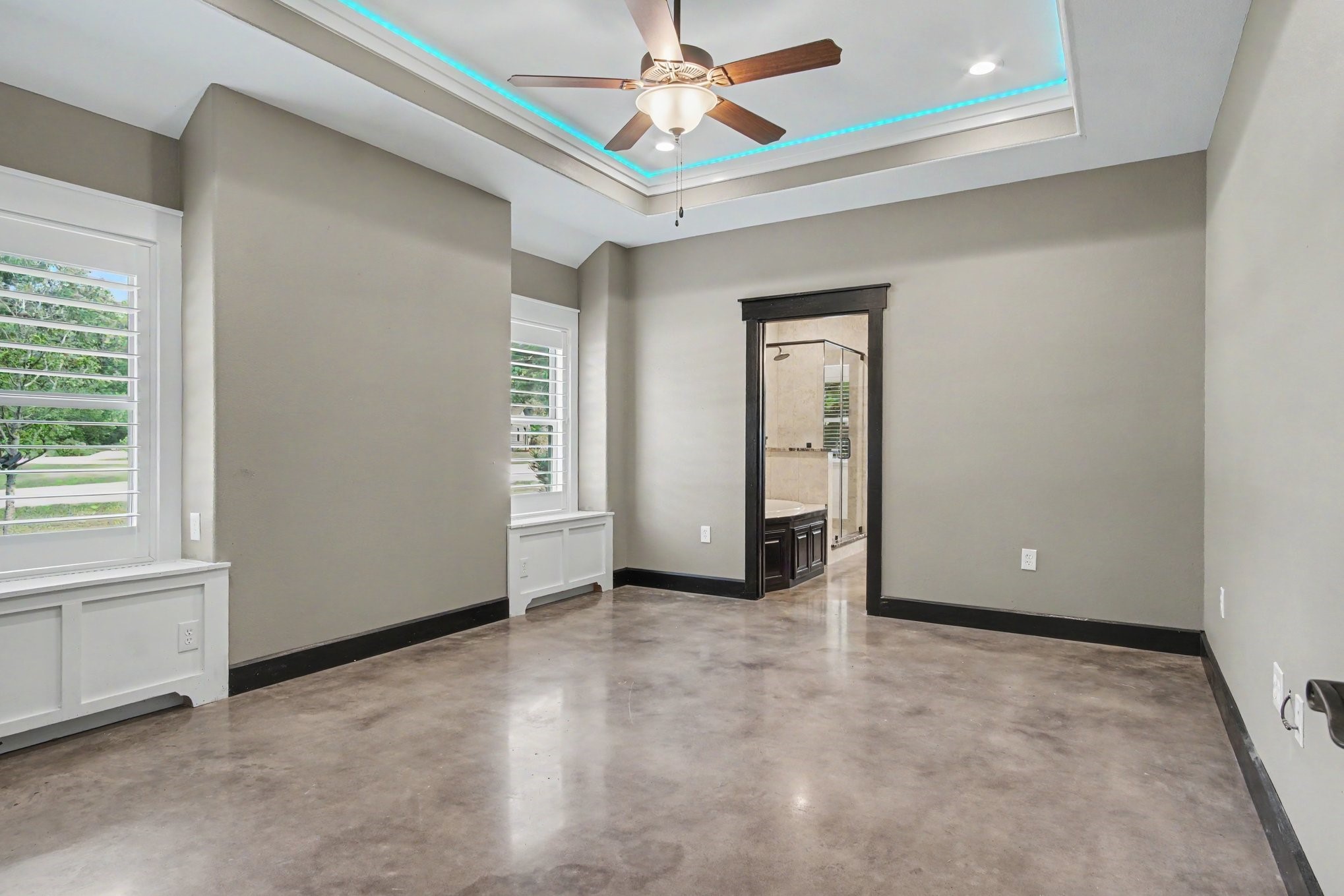 184 Bridgepoint Onalaska, TX 77360 - Photo 15 of 41 an empty room with chandelier fan and windows