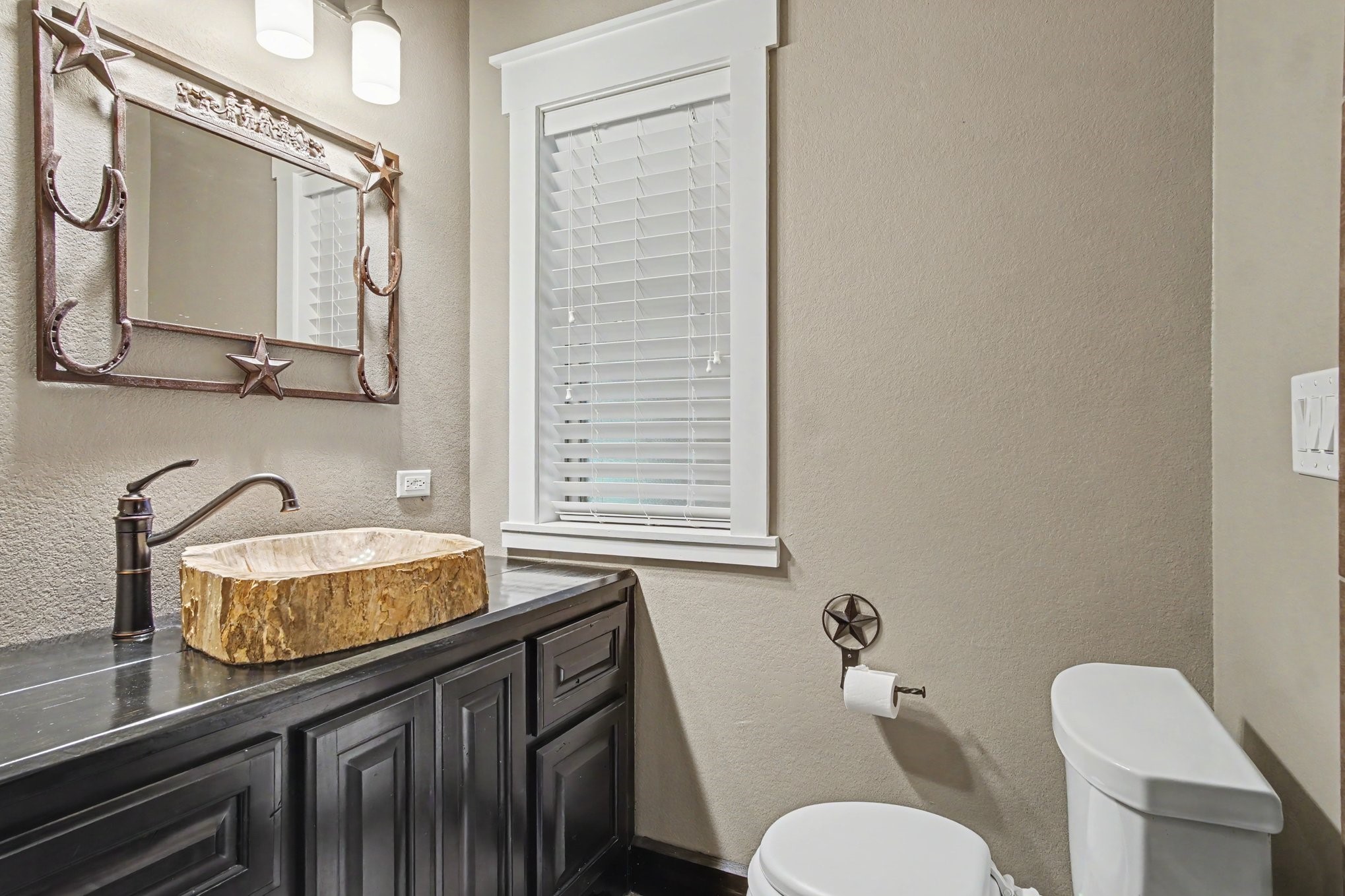 184 Bridgepoint Onalaska, TX 77360 - Photo 28 of 41 a bathroom with a granite countertop toilet sink and mirror