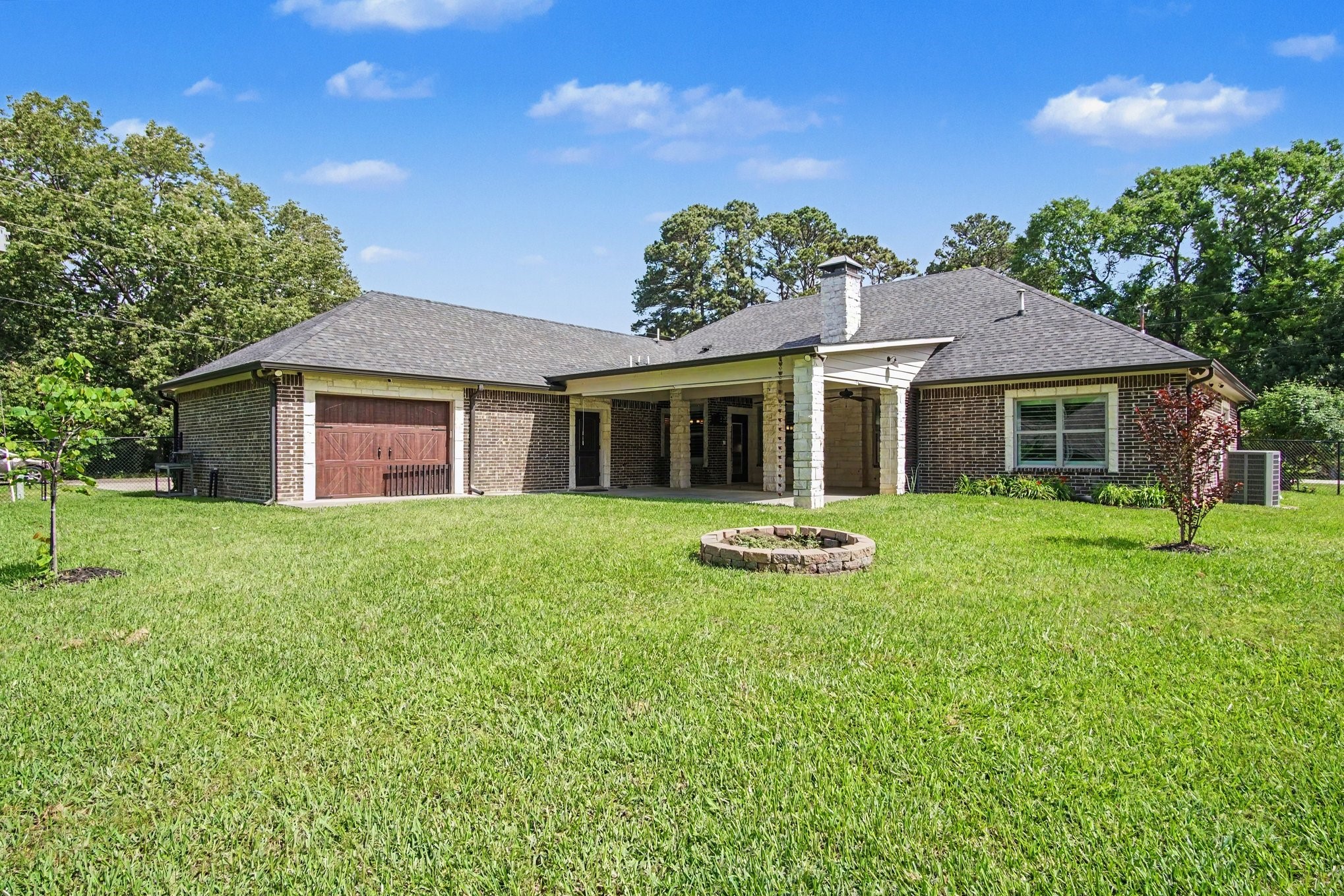 184 Bridgepoint Onalaska, TX 77360 - Photo 34 of 41 a front view of a house with yard and green space