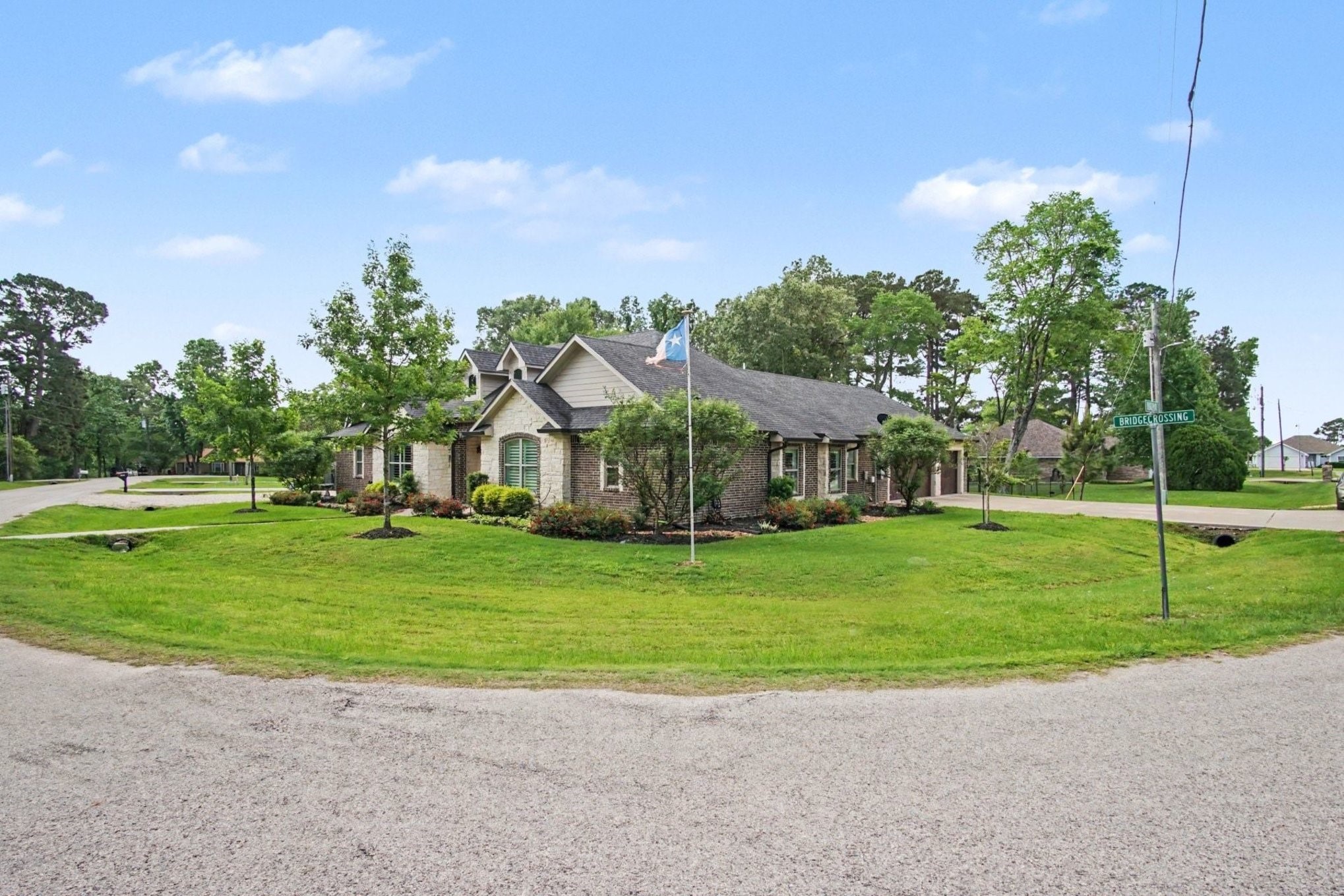 184 Bridgepoint Onalaska, TX 77360 - Photo 36 of 41 a view of a big house with a big yard and potted plants