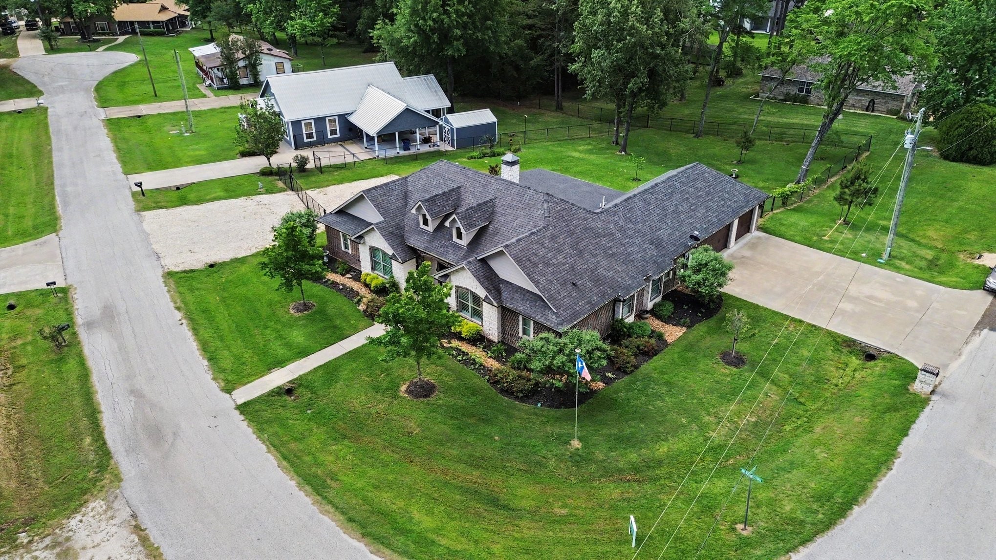 184 Bridgepoint Onalaska, TX 77360 - Photo 39 of 41 a aerial view of a house with a big yard and large trees