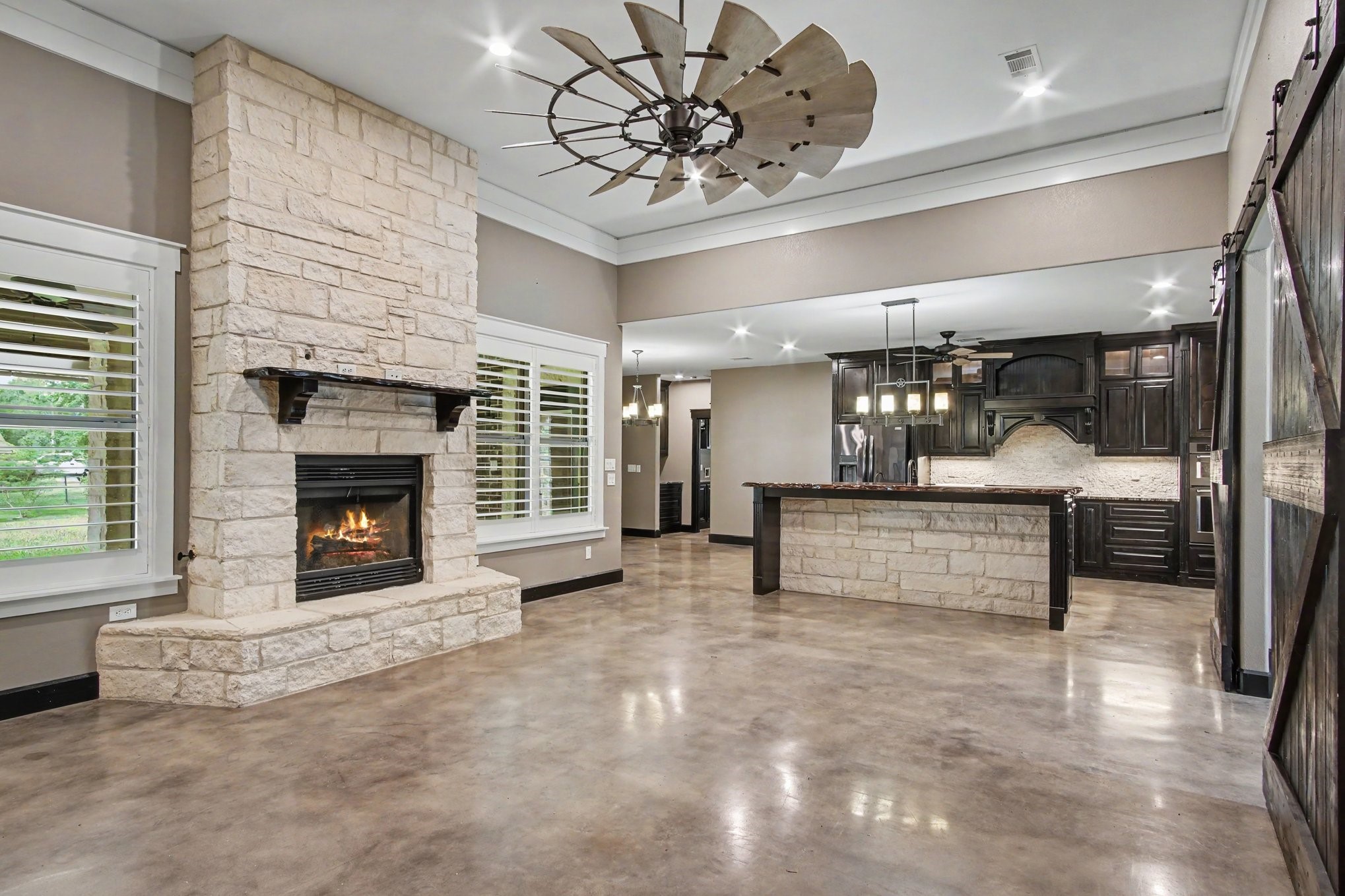 184 Bridgepoint Onalaska, TX 77360 - Photo 5 of 41 a view of a livingroom with a fireplace and a chandelier