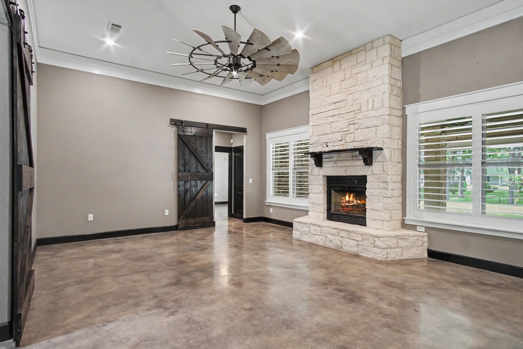 184 Bridgepoint Onalaska, TX 77360 - Photo 6 of 41 a view of an empty room with a fireplace and a window