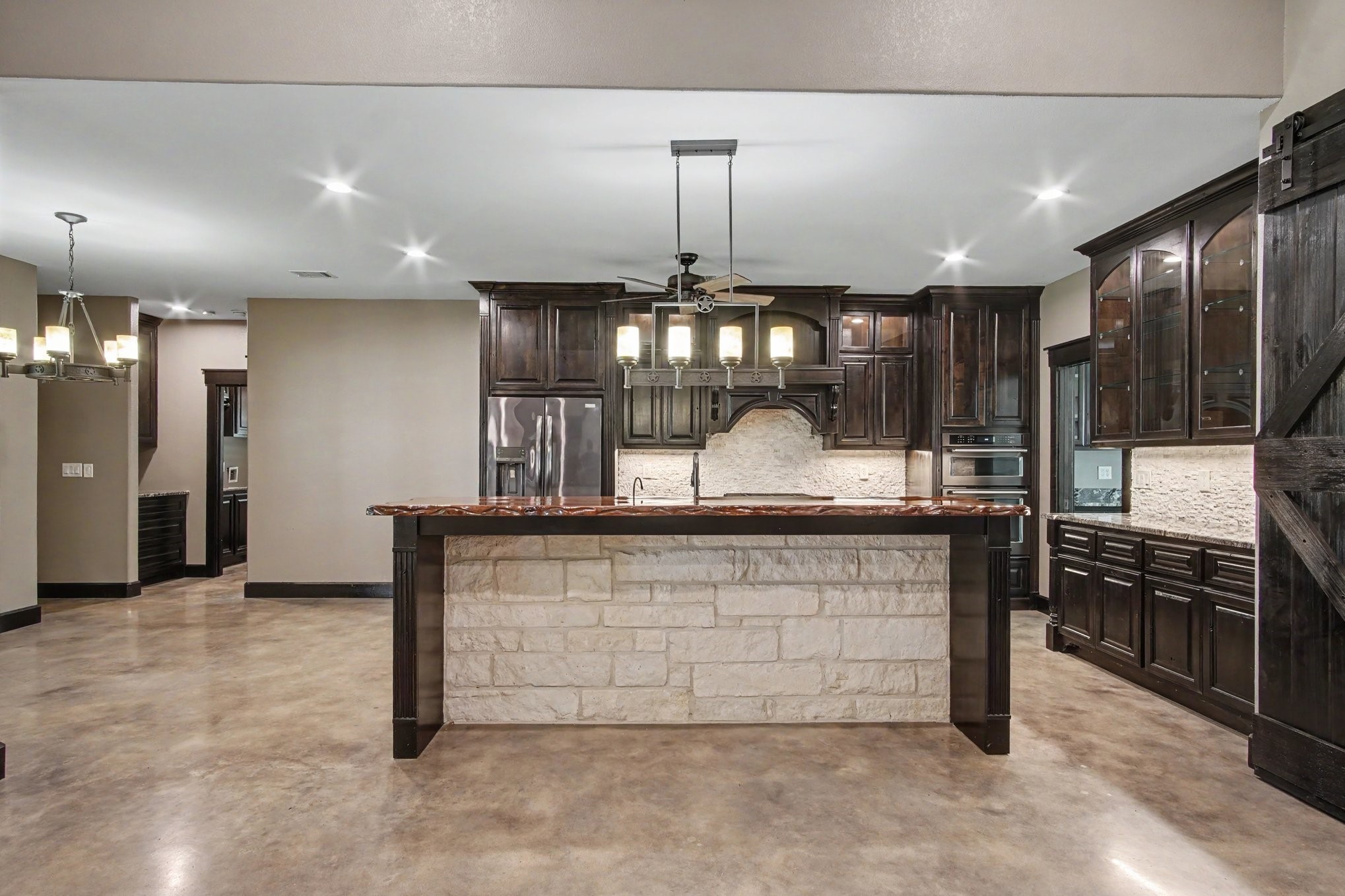 184 Bridgepoint Onalaska, TX 77360 - Photo 7 of 41 a kitchen with counter top space cabinets and stainless steel appliances