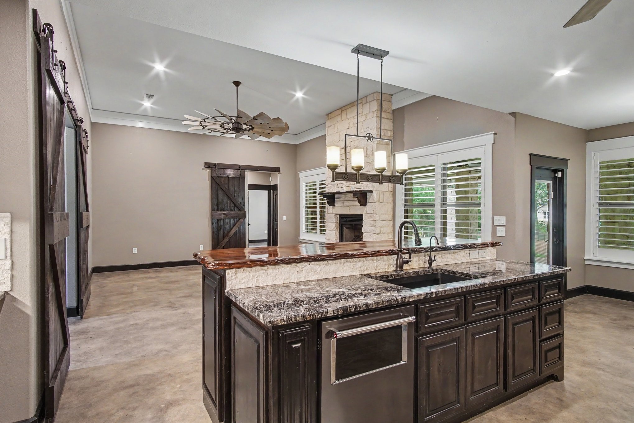 184 Bridgepoint Onalaska, TX 77360 - Photo 10 of 41 a kitchen with stainless steel appliances granite countertop a sink and a refrigerator
