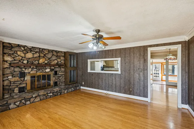 a view of livingroom with hardwood floor and a ceiling fan