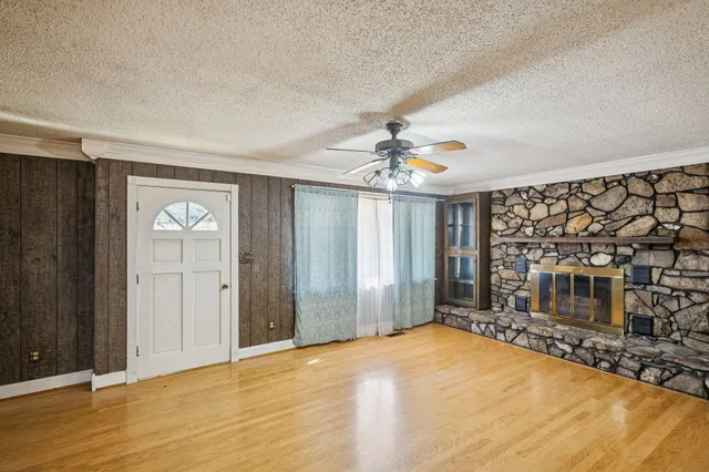 a view of livingroom with hardwood floor and ceiling fan