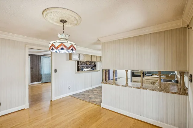 a very nice looking room with a dining table chairs