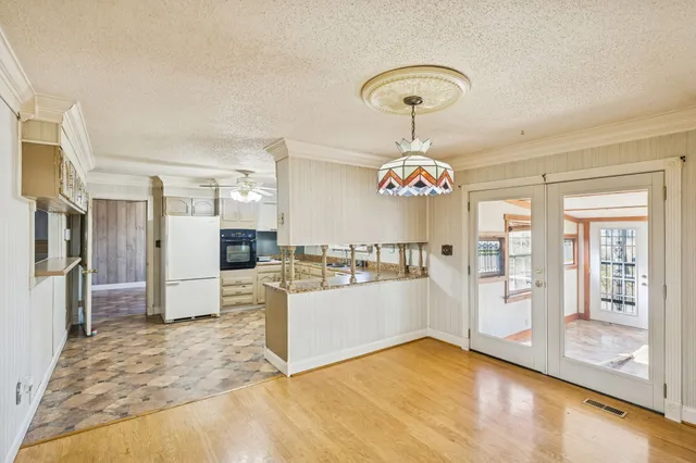 a view of a living room and kitchen