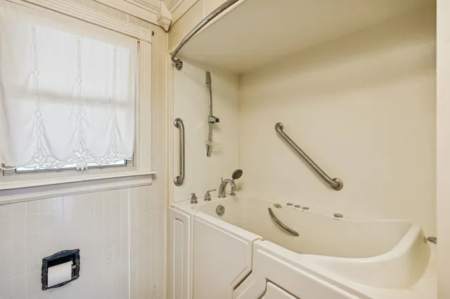 a bathroom with a tub and a sink