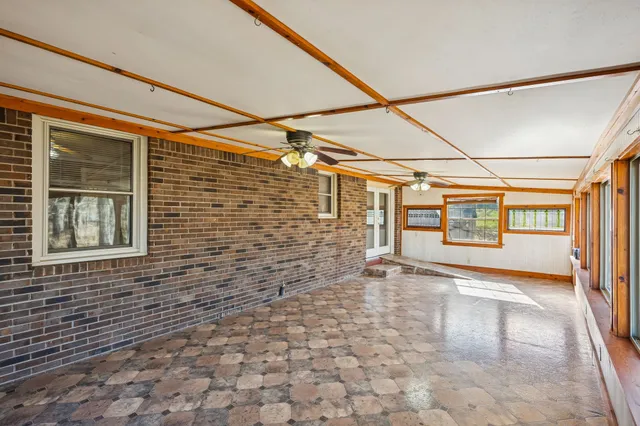 a view of empty room with windows
