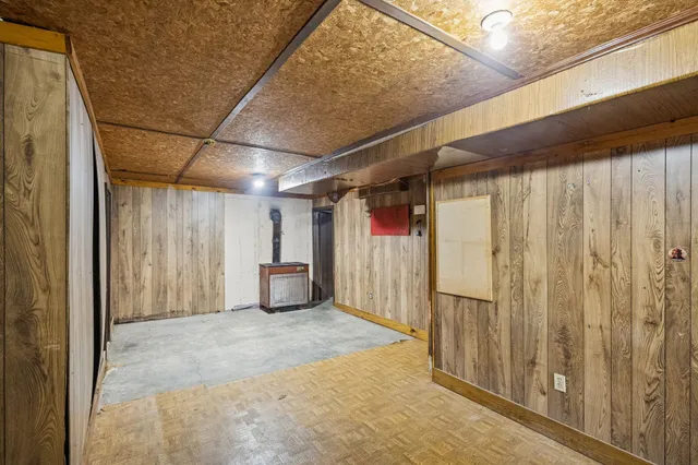 a view of water heater room with stairs