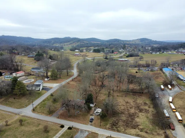 an aerial view of a house with a lake view