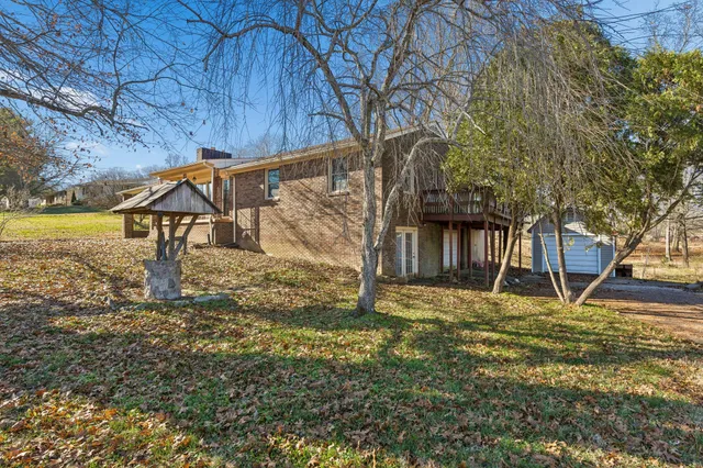 a view of swimming pool with a yard