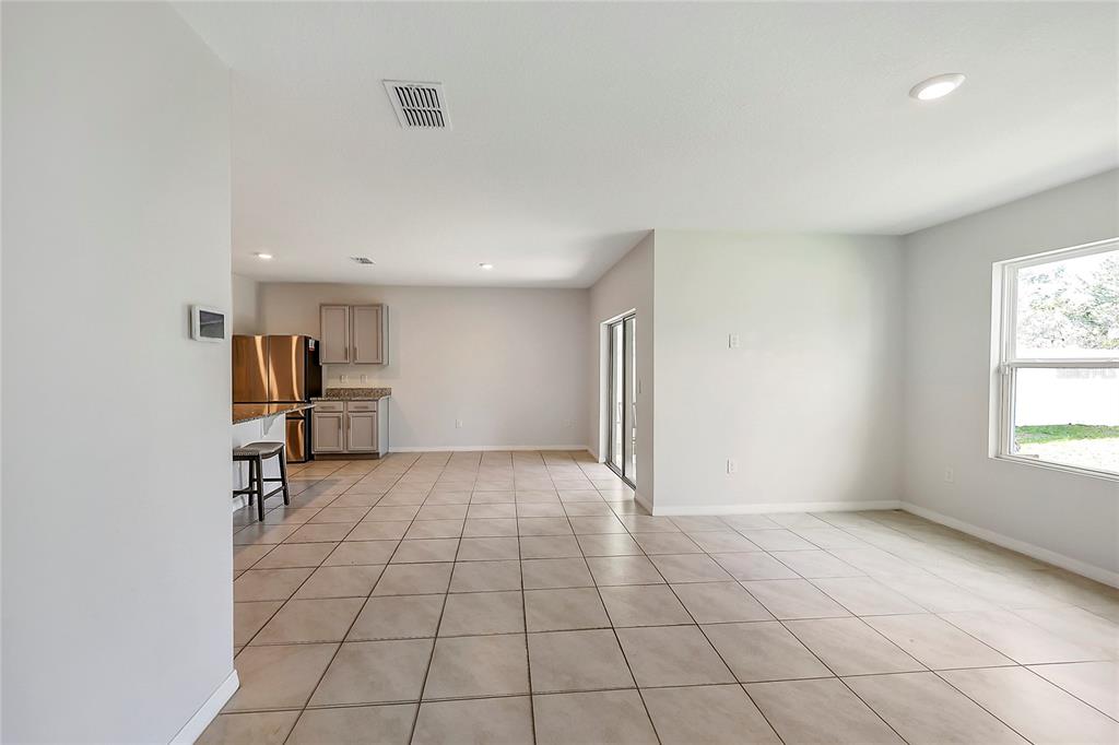 2726 Harmonia Hammock Road Harmony, FL 34773 - Photo 13 of 18 a view of an empty room and a window
