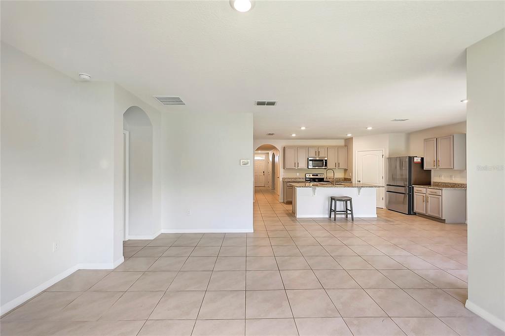 2726 Harmonia Hammock Road Harmony, FL 34773 - Photo 14 of 18 a view of kitchen with cabinets microwave and refrigerator