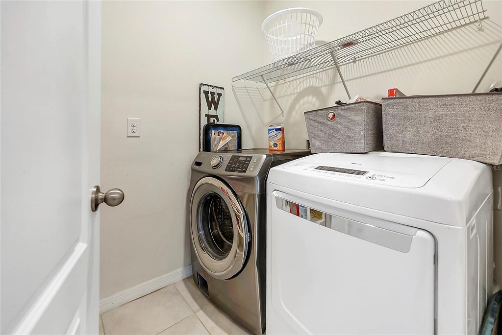 2726 Harmonia Hammock Road Harmony, FL 34773 - Photo 15 of 18 a utility room with dryer and washer
