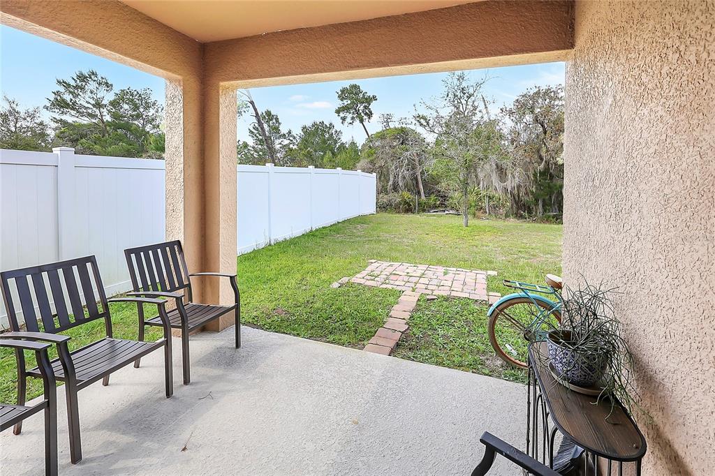2726 Harmonia Hammock Road Harmony, FL 34773 - Photo 16 of 18 a view of a two chairs in the patio