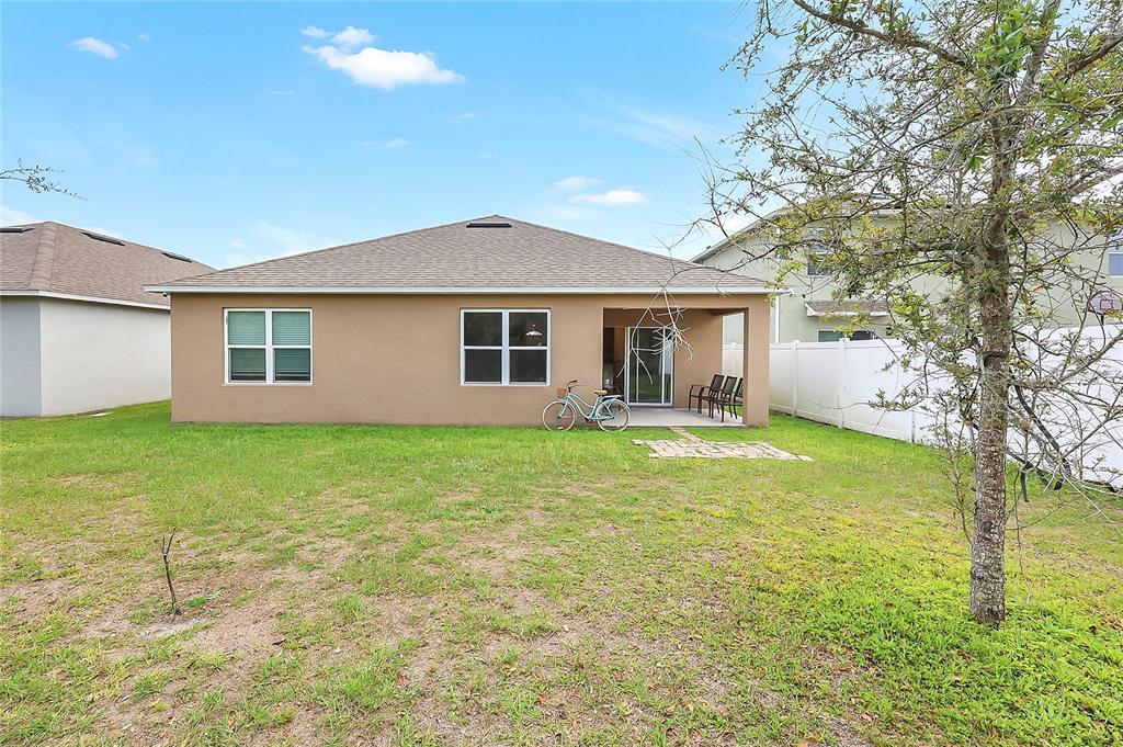 2726 Harmonia Hammock Road Harmony, FL 34773 - Photo 18 of 18 a front view of house with yard and green space