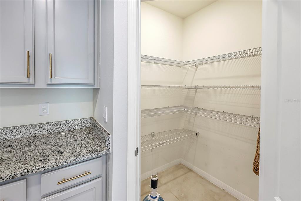 2726 Harmonia Hammock Road Harmony, FL 34773 - Photo 10 of 18 a bathroom with washing machine and cabinets