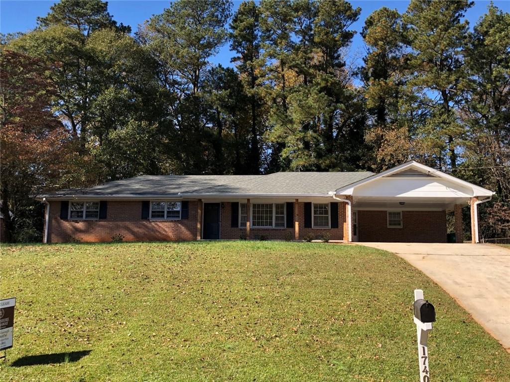 1740 Samaria Trail Tucker, GA 30084 - Photo 2 of 31 a front view of house with yard and trees around