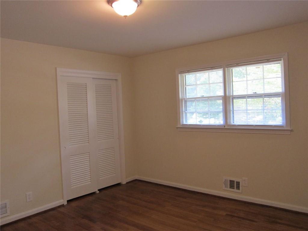 1740 Samaria Trail Tucker, GA 30084 - Photo 21 of 31 an empty room with wooden floor and windows