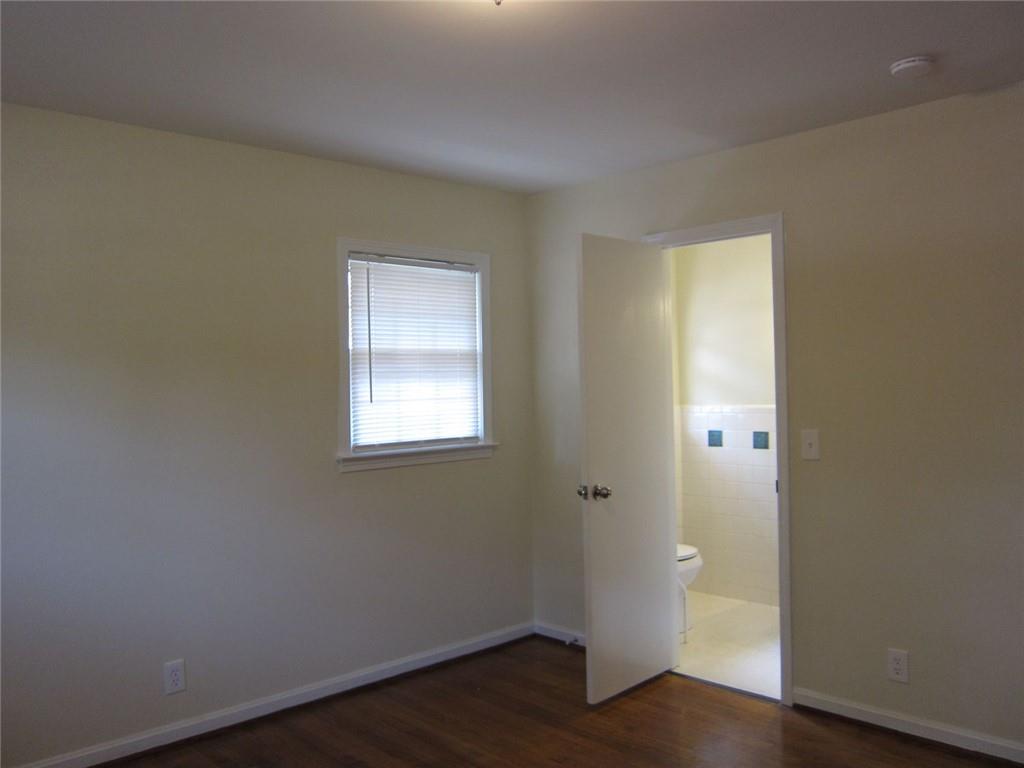 1740 Samaria Trail Tucker, GA 30084 - Photo 22 of 31 an empty room with wooden floor and windows