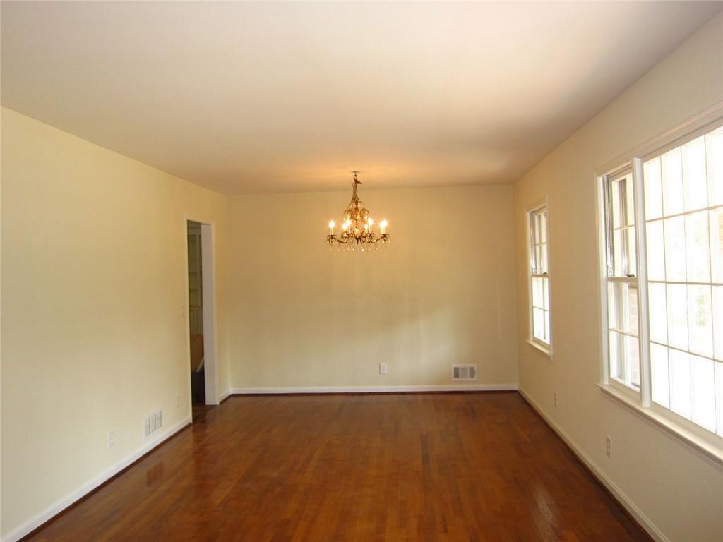 1740 Samaria Trail Tucker, GA 30084 - Photo 4 of 31 wooden floor in an empty room with a window