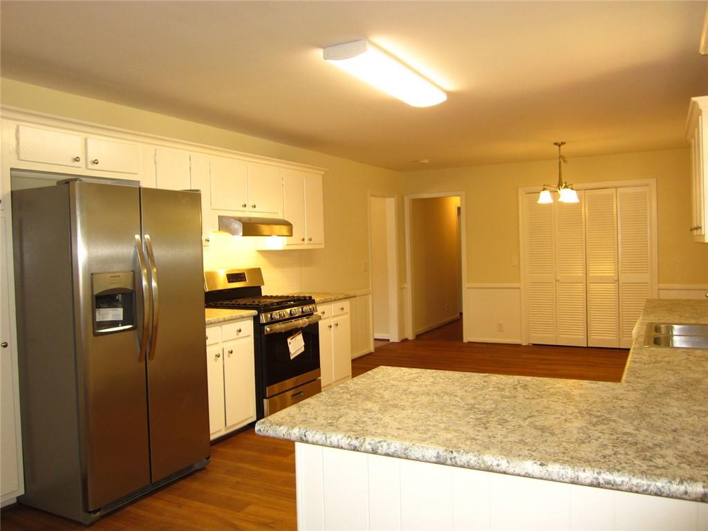 1740 Samaria Trail Tucker, GA 30084 - Photo 6 of 31 a kitchen with stainless steel appliances granite countertop a refrigerator and a sink