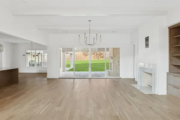 a view of a livingroom with furniture wooden floor and window