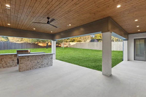 an aerial view of a house with garden space and street view