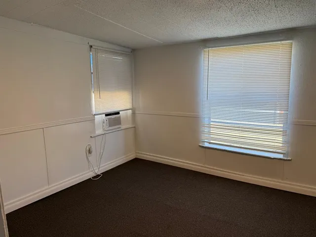 a view of a room that has a window in it