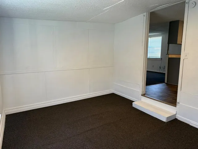 an empty room with a bench