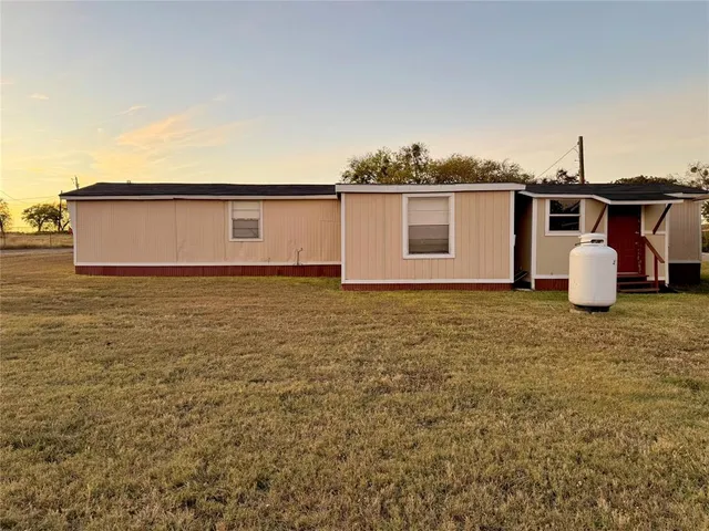 a view of a house with backyard space
