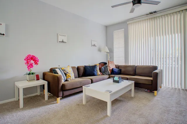 a living room with furniture and a couch
