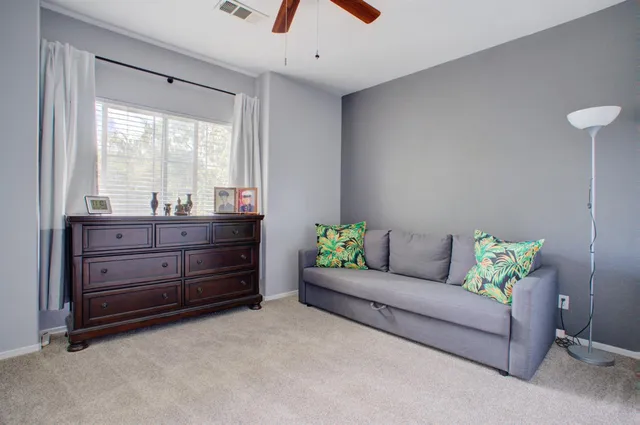 a living room with furniture and a window