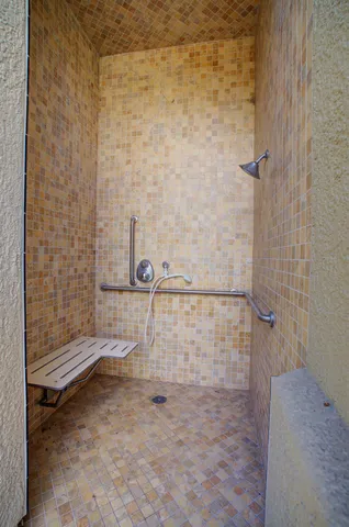 a large room with a large window and couches