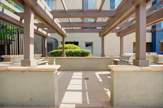 a swimming pool with outdoor seating and yard